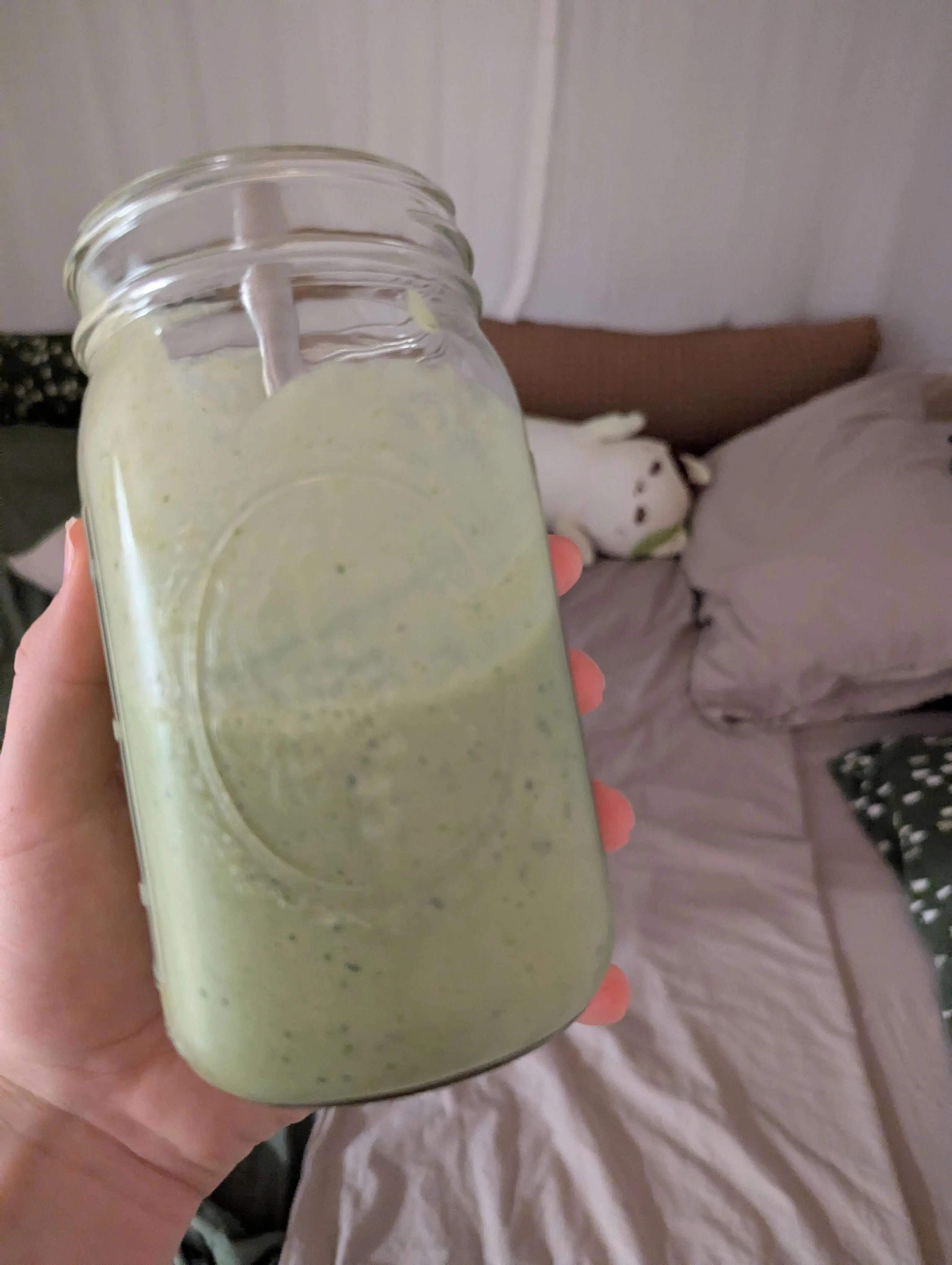 Gen's matcha colored bed and matcha colored smoothie